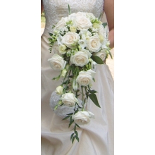 Avalanche roses, bouvardia, freesia, veronica and lisianthus with French ruscus and enhanced with diamanté pins.
