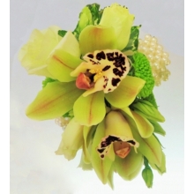 Cymbidium orchid, lisianthus and spray chrysanthemum with ivy leaves mounted on a pearl bracelet.