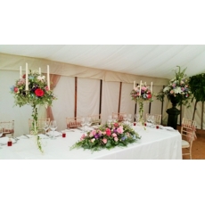 Top table arrangement, candelabras and lily urn.