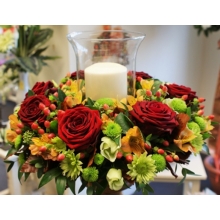 Red Naomi rose, hypericum berries, lisianthus and spray chrysanthemum with coordinating foliage.