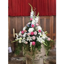 Font decorated with Sweet Avalanche, Avalanche Pink and All 4 Love roses, delphinium, lily, gladioli, chrysanthemum blooms, lisianthus and limonium with coordinating foliage.
