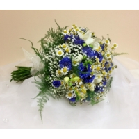 Cornflower, freesia, tanacetum and gypsophila with asparagus fern bound with ivory voile ribbon.