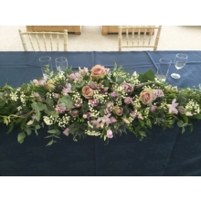 Long and low top table arrangement