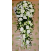 Akito rose, bouvardia, lisianthus, freesia and heather with French ruscus and asparagus fern enhanced with diamanté pins.