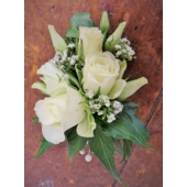 Spray rose, lisianthus and gypsophila with ivy leaves enhanced with pearl clusters.