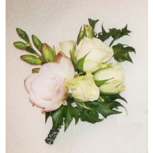 Spray rose and freesia with ivy leaves enhanced with diamanté clusters.
