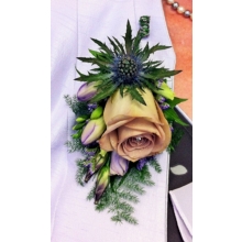 Memory Lane rose, eryngium, freesia, lisianthus and limonium with ivy leaves and asparagus fern enhanced with a diamanté pin.